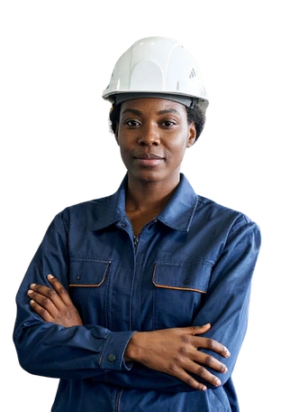 A tradeswoman in work clothes wearing a hard hat